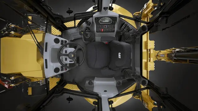 Фото кабины экскаватора погрузчика Caterpillar